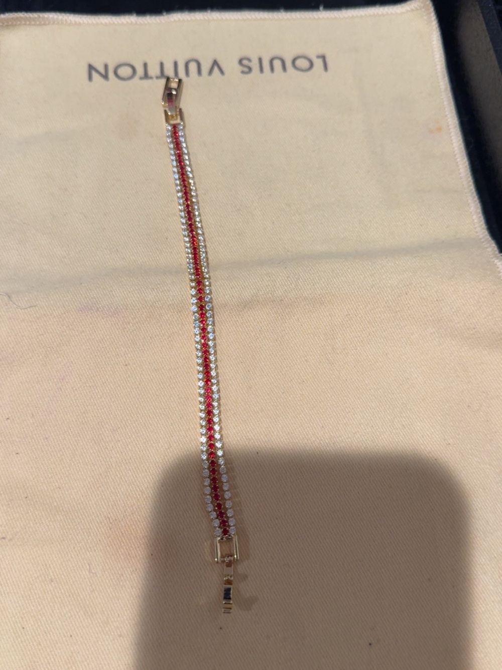 Gold and red tennis bracelet